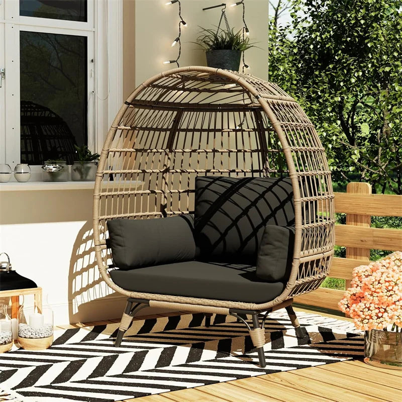 Oversized wicker egg chair with cushions and steel frame