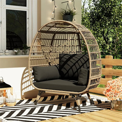 Oversized wicker egg chair with cushions and steel frame
