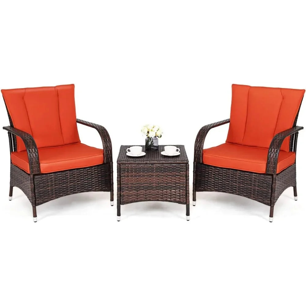 Three-piece wicker patio furniture set with glass table