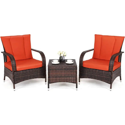 Three-piece wicker patio furniture set with glass table