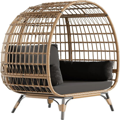 Oversized wicker egg chair with cushions and steel frame