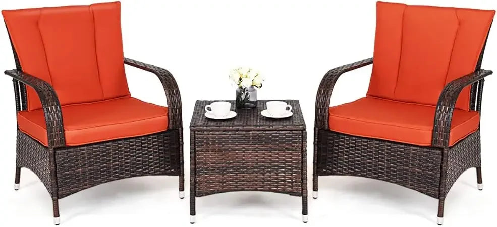 Three-piece wicker patio furniture set with glass table