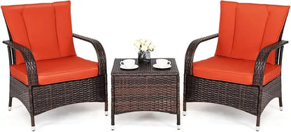 Three-piece wicker patio furniture set with glass table