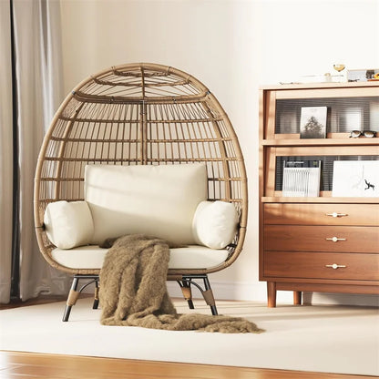 Oversized wicker egg chair with cushions and steel frame
